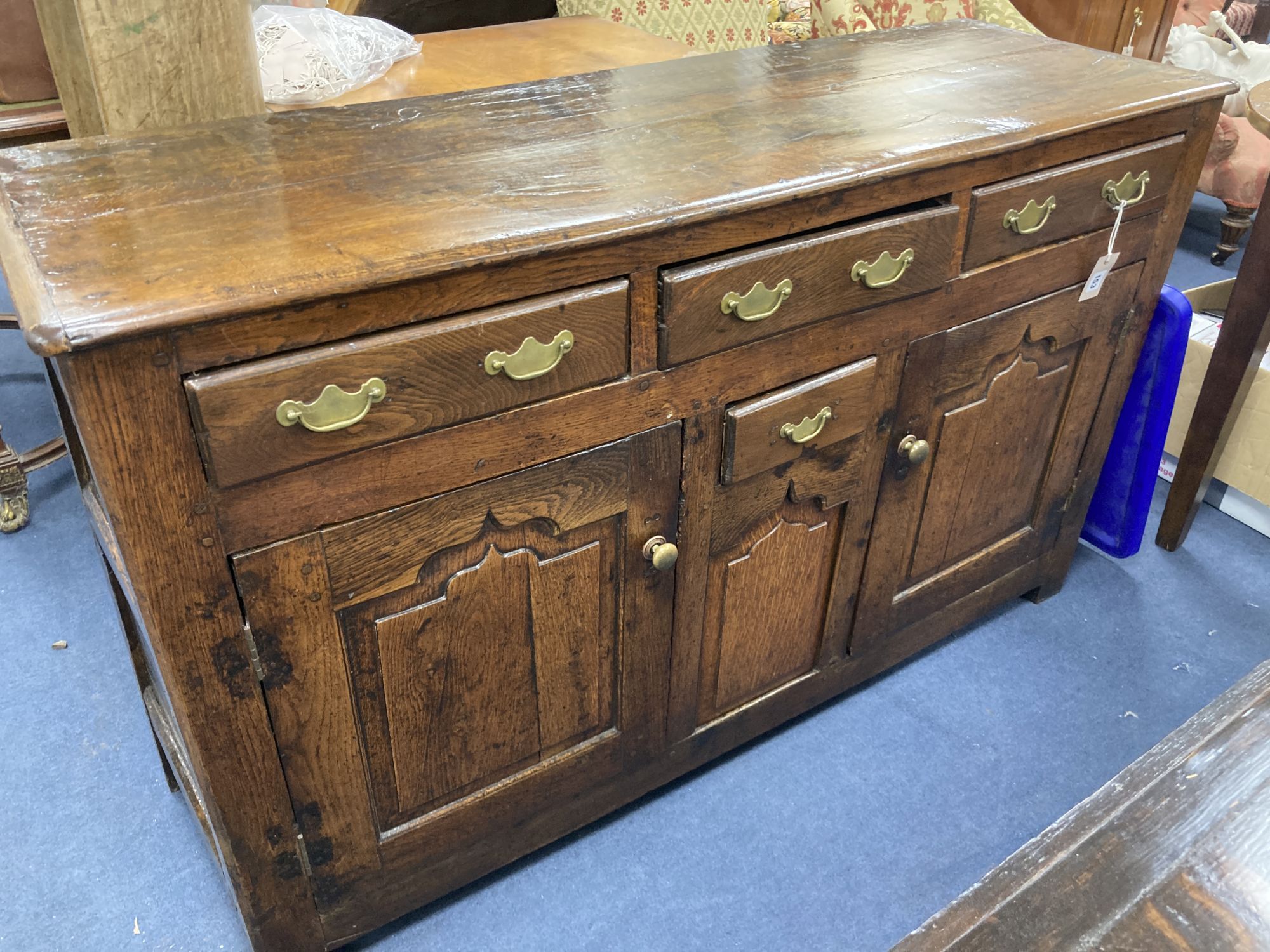 A mid 18th century oak dresser base, length 140cm, depth 46cm, height 86cm